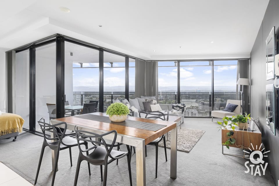 Dining area is right next to the living room overlooking the city and the river 