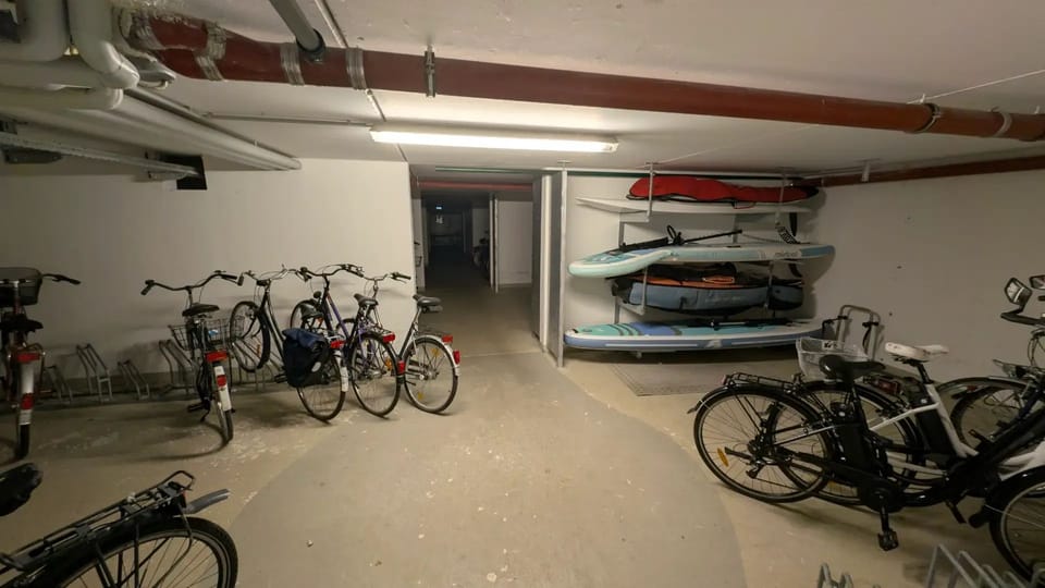 Storage room with bicycles, SUP boards and kayaks - basement