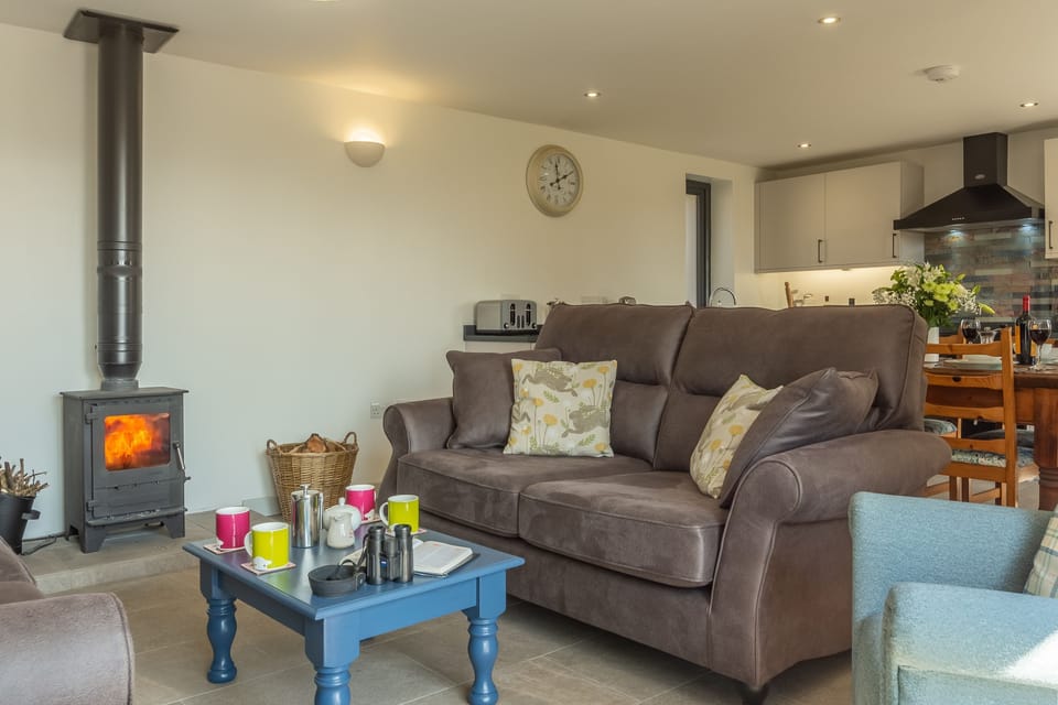 Cosy up in front of the wood burning stove at the end of the day