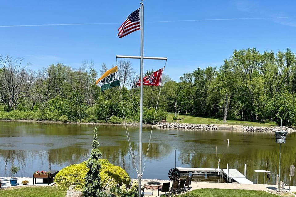 Our flags proudly hang in the flower garden