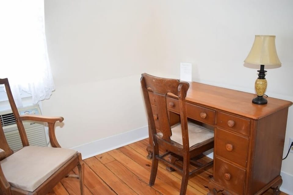 Cozy office with window air conditioning provides a quiet spot to work or relax.