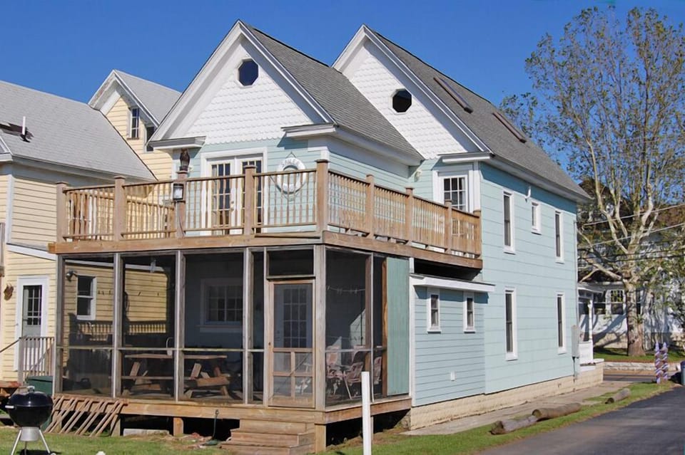 Back of House with Screened in Porck and Balcony 