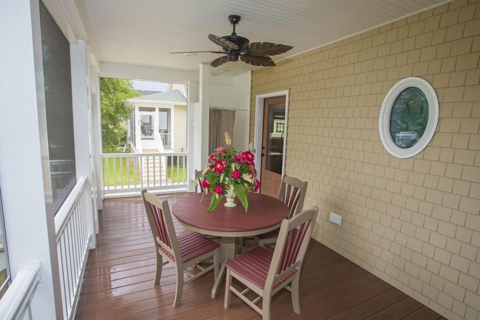 Seating and Outdoor Shower on Screened in Porch