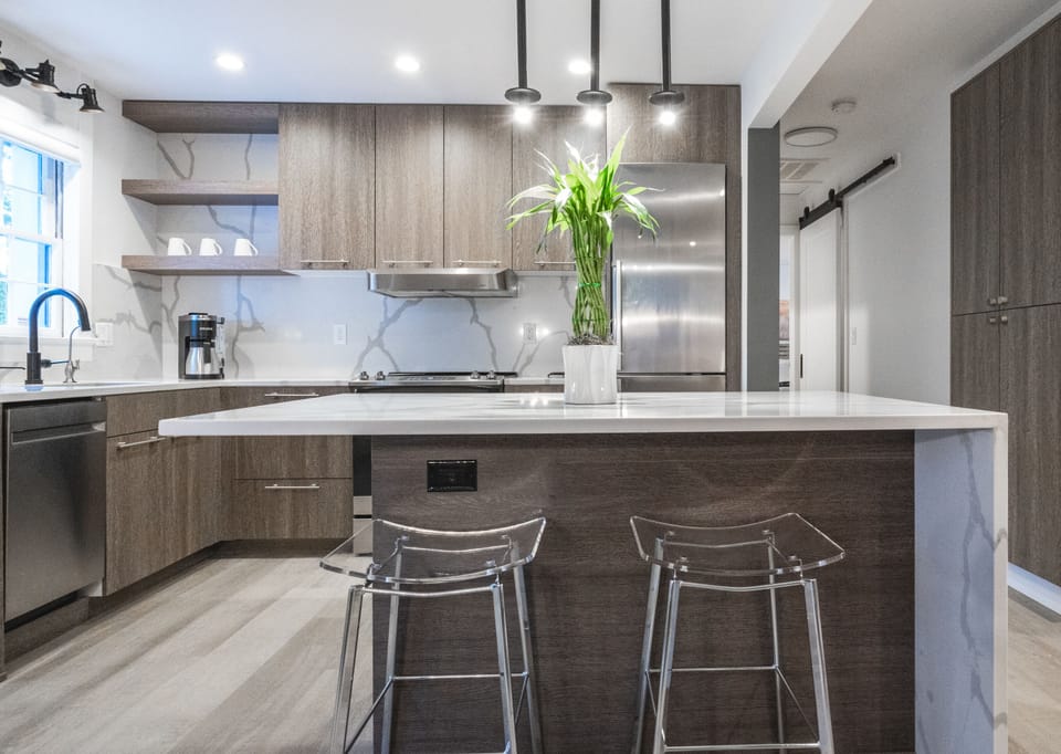 Work or eat at the spacious island close to the fridge and hall pantry