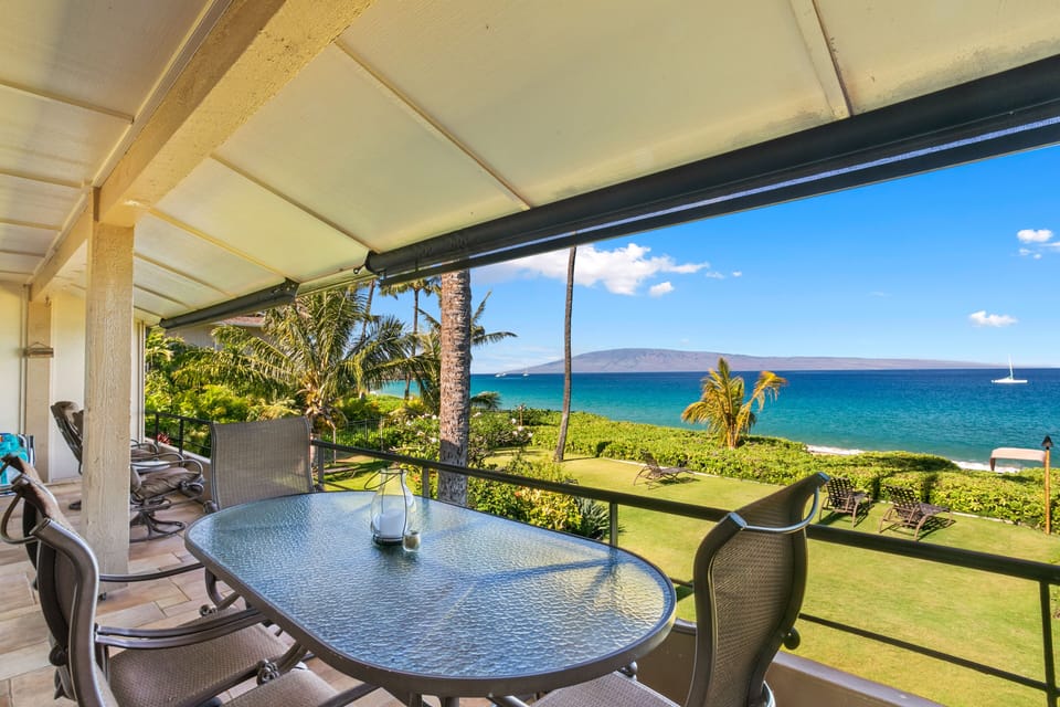 Sip your morning coffee at your private balcony table while soaking in unobstructed turquoise ocean views, swaying palms, and the neighboring island on the horizon—pure paradise.
