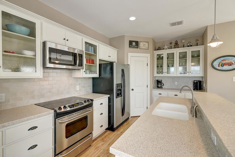 Your fully equipped kitchen awaits with granite counters, stainless appliances, and everything you need to create memorable meals during your stay.
