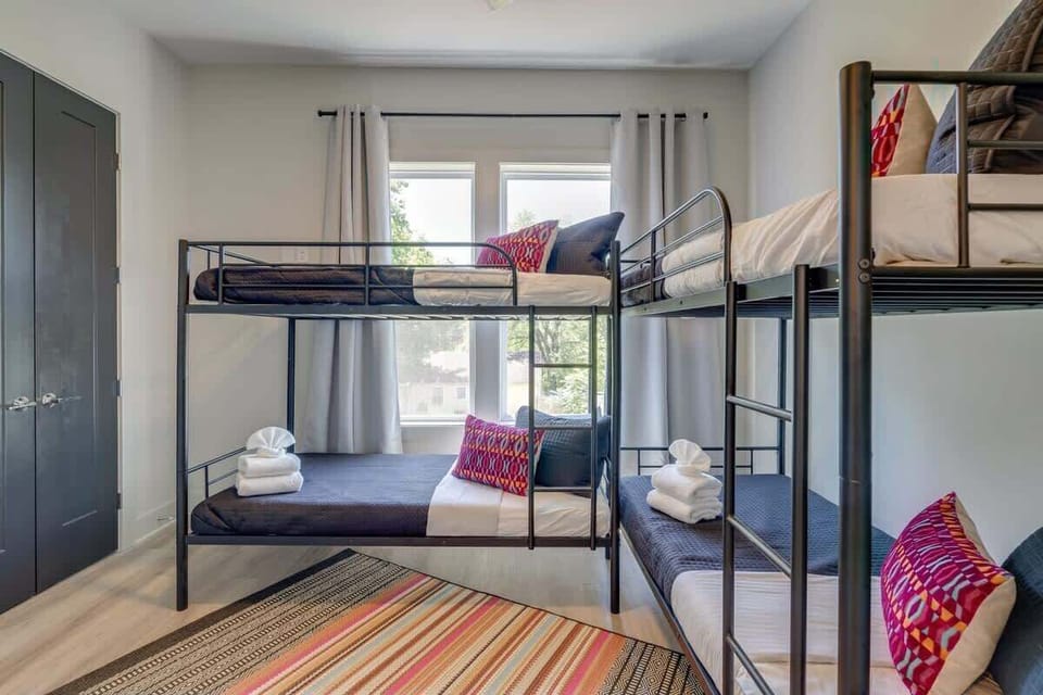Bunk beds with natural light from the window make bunking up feel easy, so every guest gets their own cozy corner to crash after exploring East Nashville