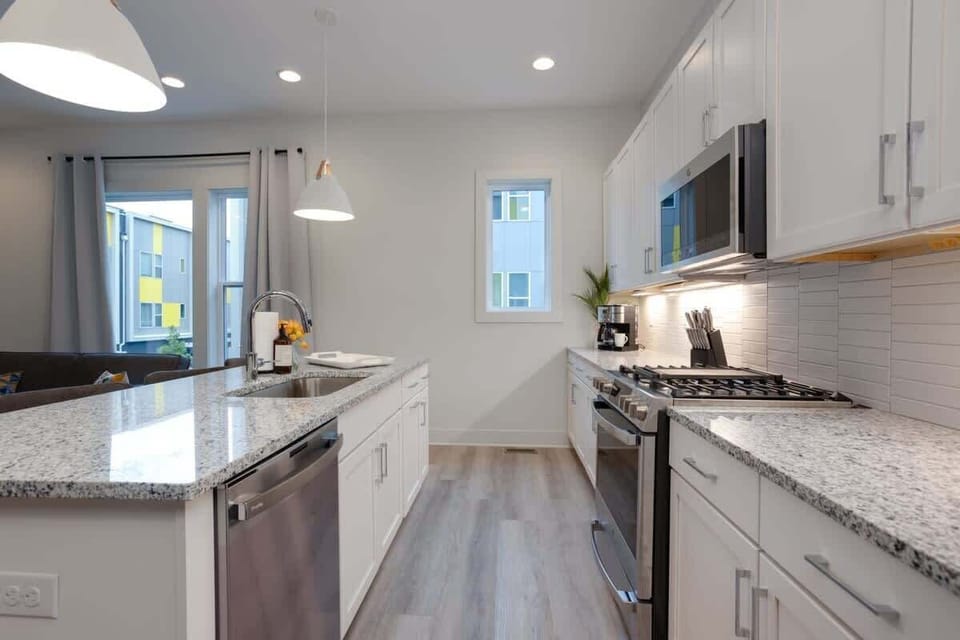 The kitchen island is where the group gathers to cook, eat, and scheme your downtown Nashville adventure. Stainless steel appliances handle whatever you're throwing at them