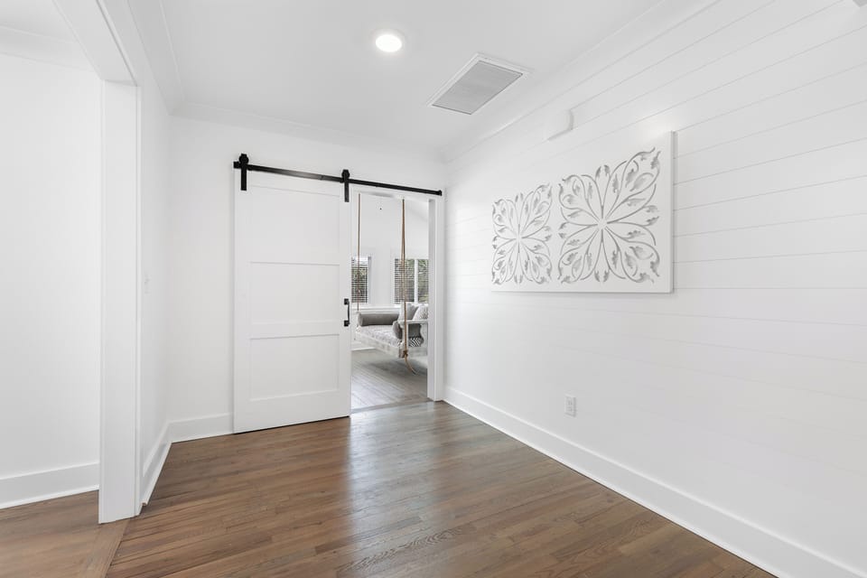 Enter your sitting room through this rustic barn door