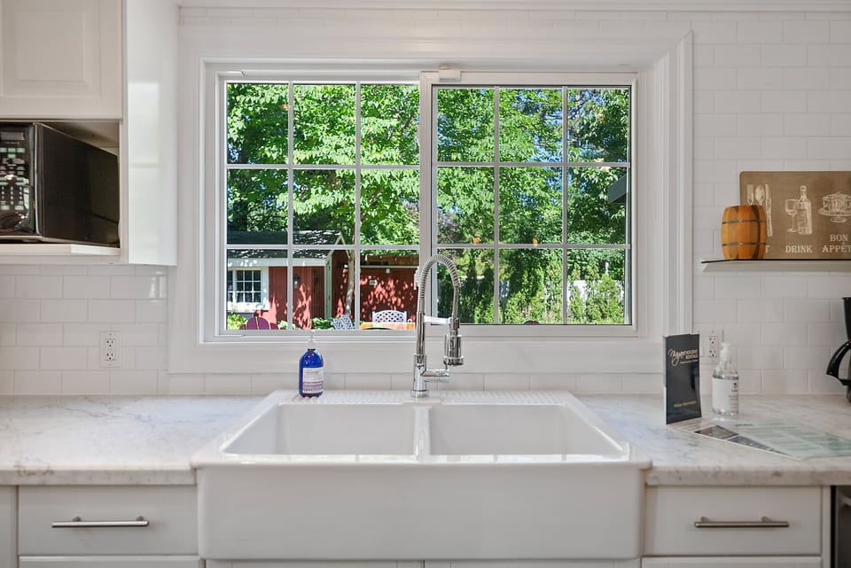 Full kitchen with views of the back garden at The Rosette House in Old Town Niagara-on-the-Lake