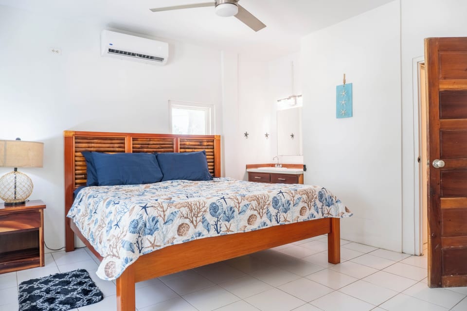 Featuring a sink and mirror to freshen up  without leaving your bedroom