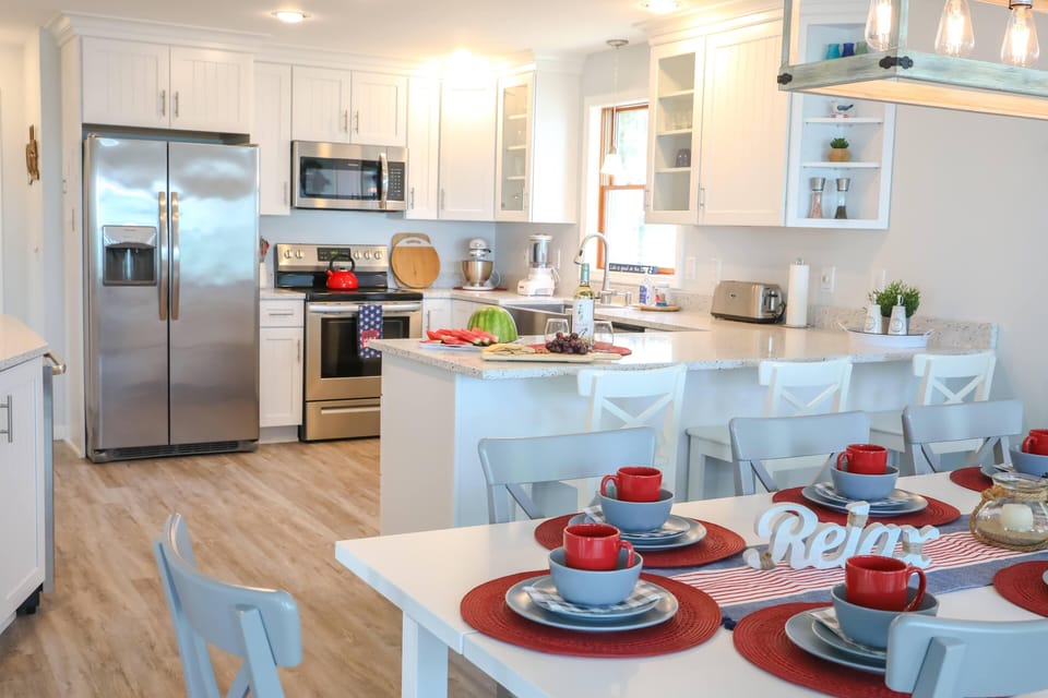 Well stocked kitchen with stainless steel appliances