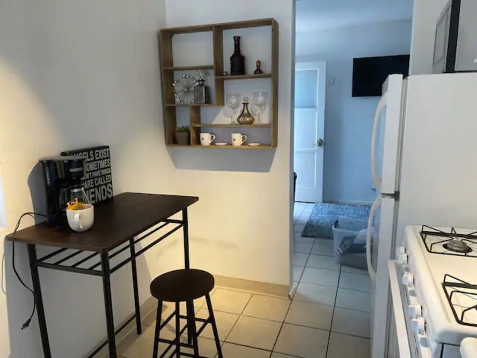 Kitchen with stove, oven, refrigerator and microwave.  