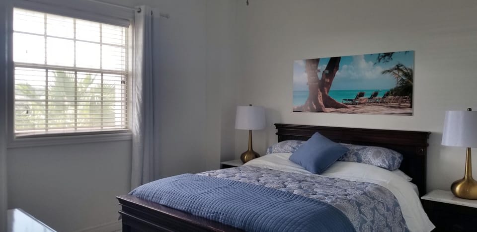 Master bedroom with block out curtains and shutters