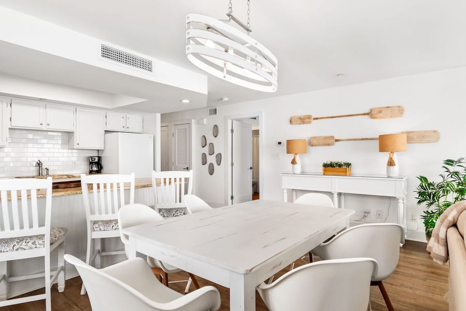 Your bright, open dining space flows seamlessly into a fully equipped kitchen, perfect for morning coffee or evening meals together.