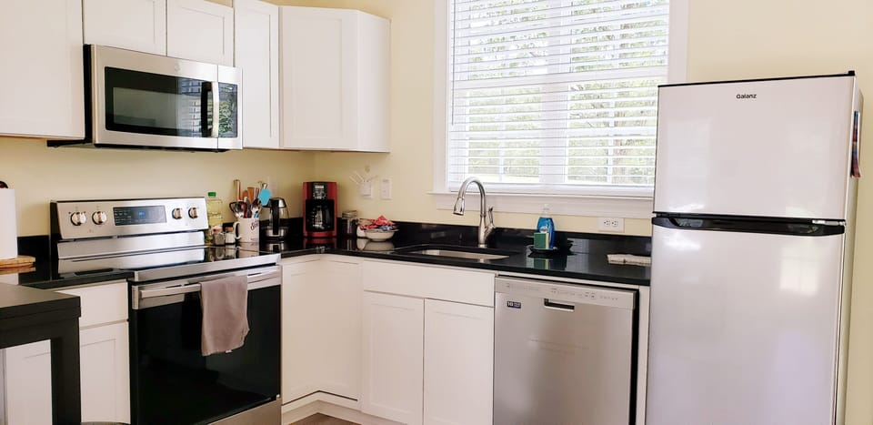 Kitchen with full size appliances: Stove, Oven Microwave Refrigerator Dishwasher