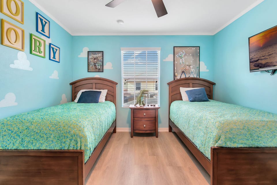 Bedroom #4 toy story room with two twin beds and Smart TV on second floor
