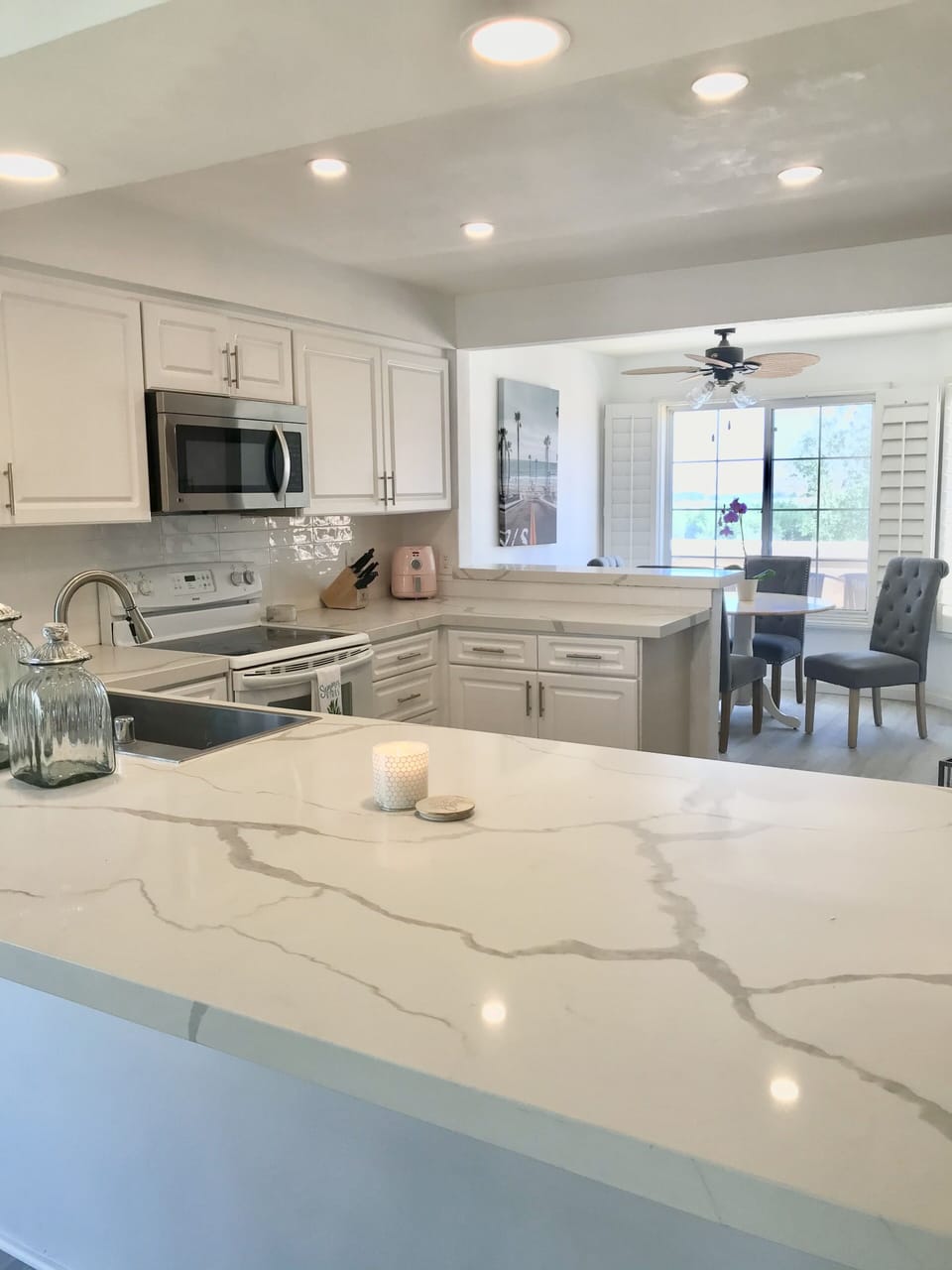 We have a table for 4 in the breakfast nook.  Quartz countertops and island. 