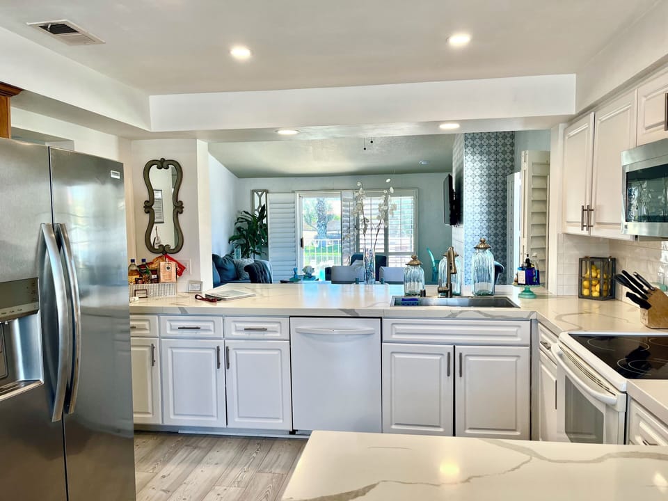 Kitchen faces the back patio and pool