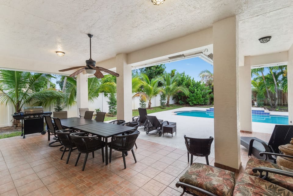 Lanai with Grill & Dining Area By The Pool