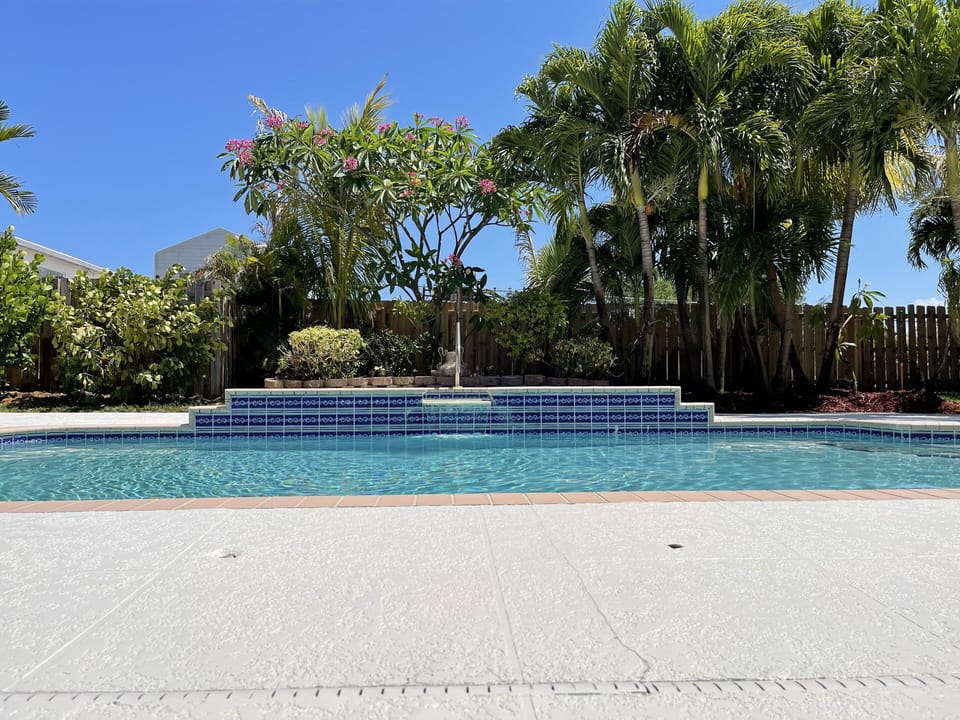 Private & fenced back yard with pool & hot tub