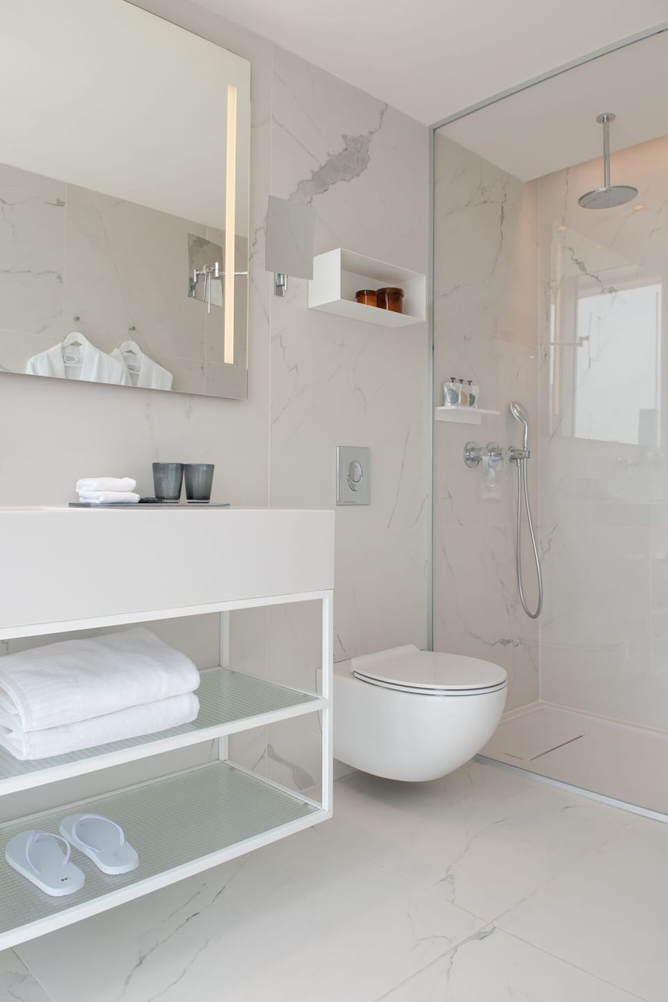 Designer toiletries, hair dryer, bathrobes, slippers