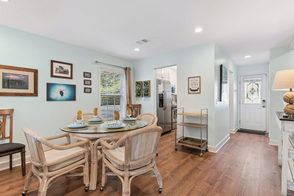 Gather with loved ones at the dining table where coastal charm meets everyday comfort, with fresh natural light and easy access to your fully-equipped kitchen.