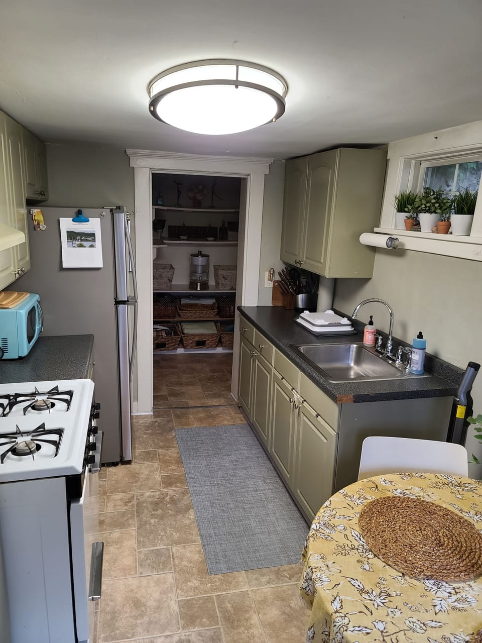 Kitchen fully stocked with appliances 