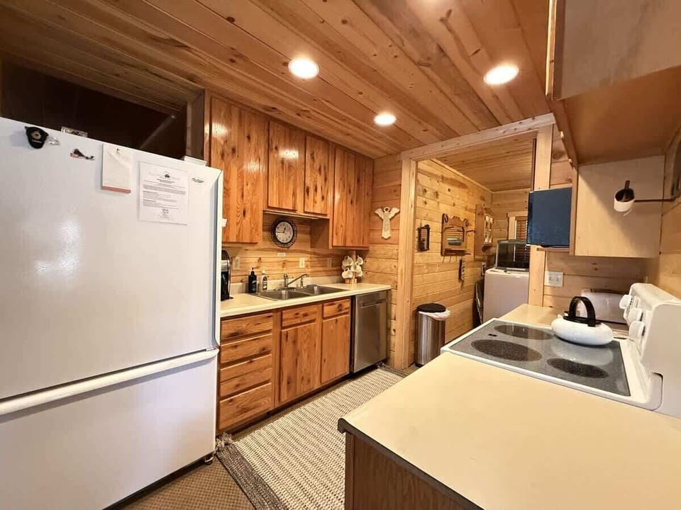 Large Galley Kitchen. Large fridge and dishwasher.