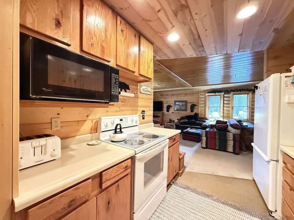 Another view of the full galley kitchen. Electric range and microwave.