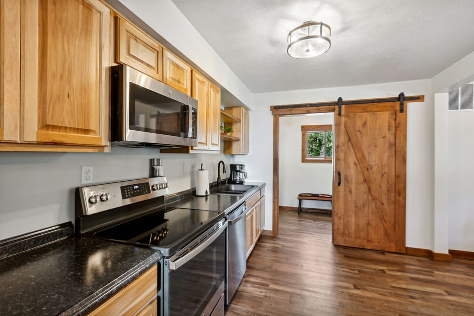 Fully stocked kitchen with functioning barn door.