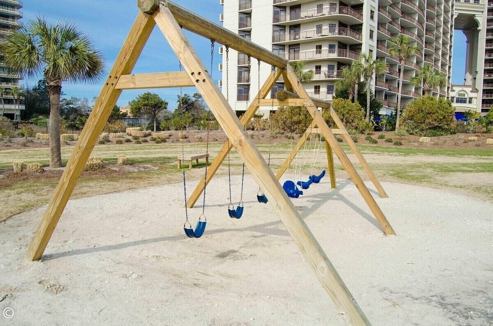 Play area & Volleyball Court near Beachside pool & beach.