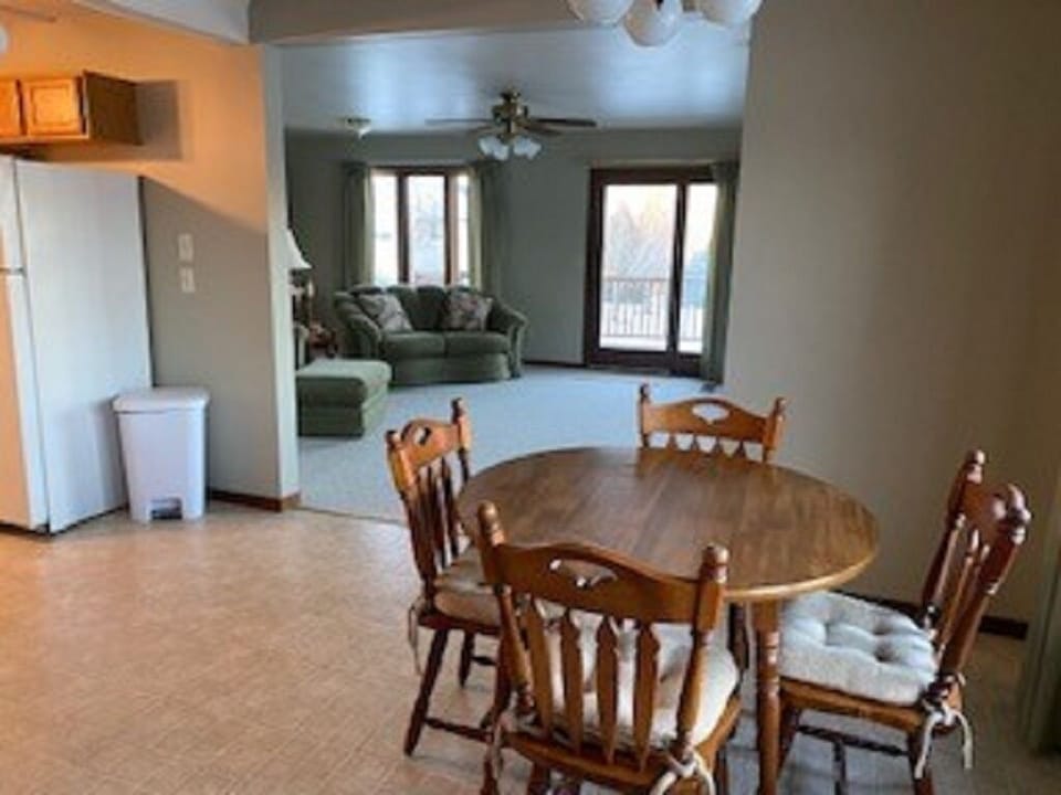 Dining and kitchen open to living room