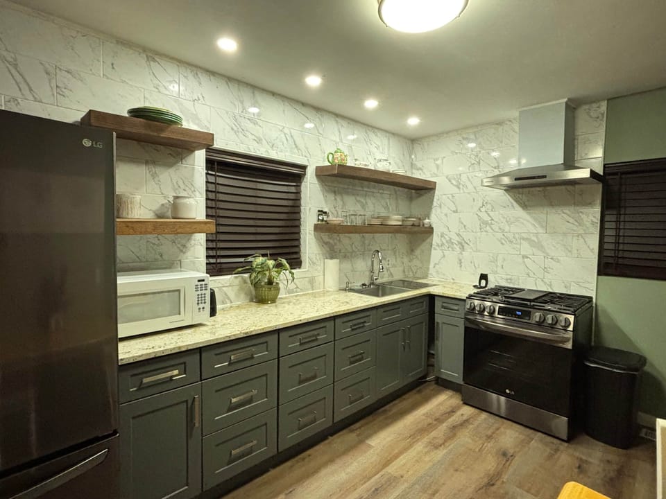 Full kitchen with upgraded appliances and gas rangeIMG 0361