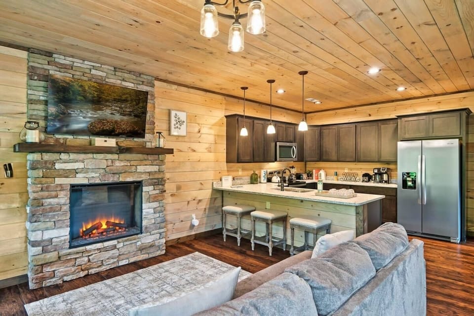 1st floor entry and kitchen.  Walk in to a cozy sitting area with fireplace and flatscreen smartTV (above the fireplace!) for gathering while you cook.