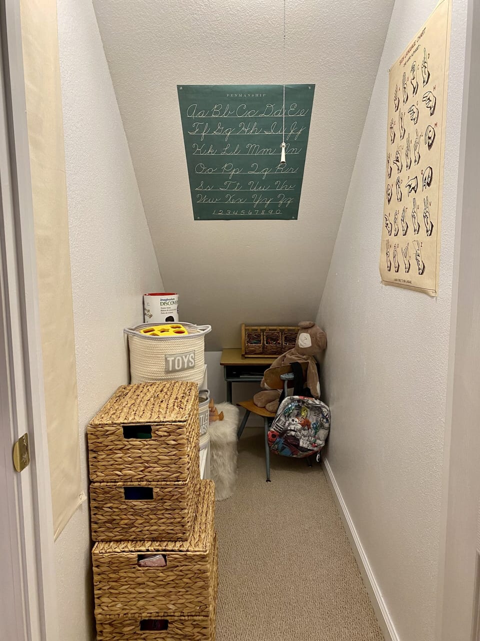 Kids playroom with lots of toys and coloring books.