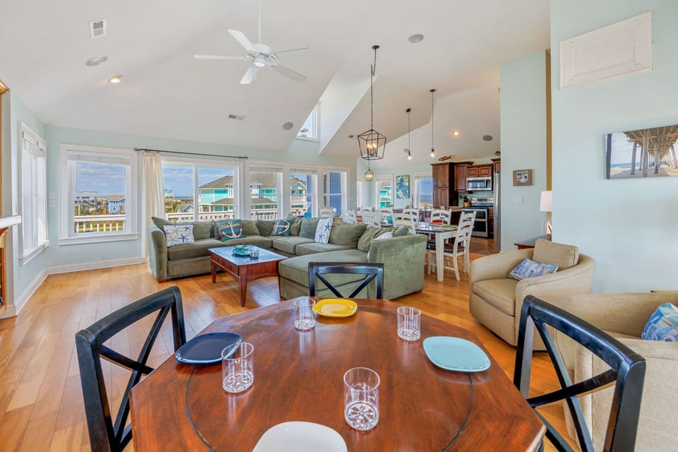 The top level great room features vaulted ceilings, ample natural light, and abundant relaxation.