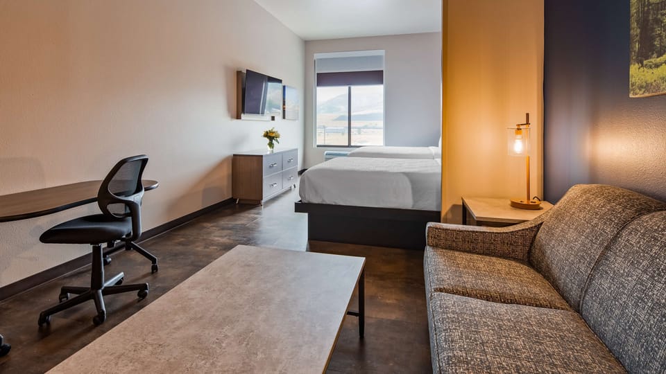 Hypo-allergenic bedding, desk, laptop workspace, blackout drapes