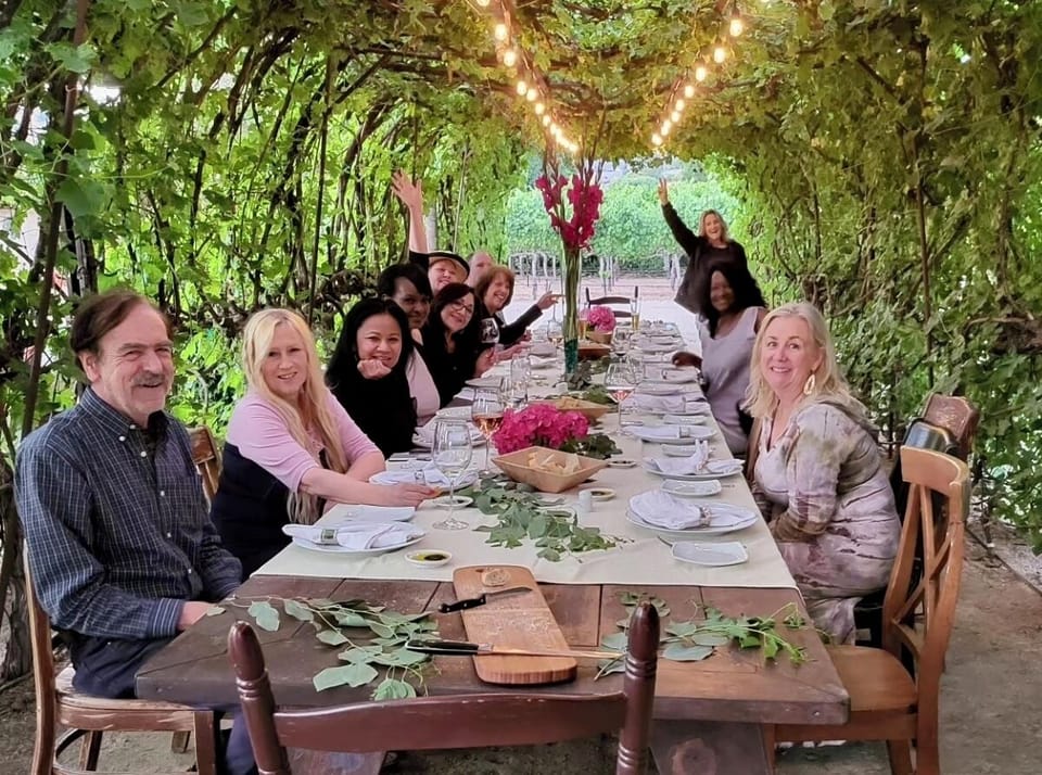 Dine with friends under the grapevine pergola