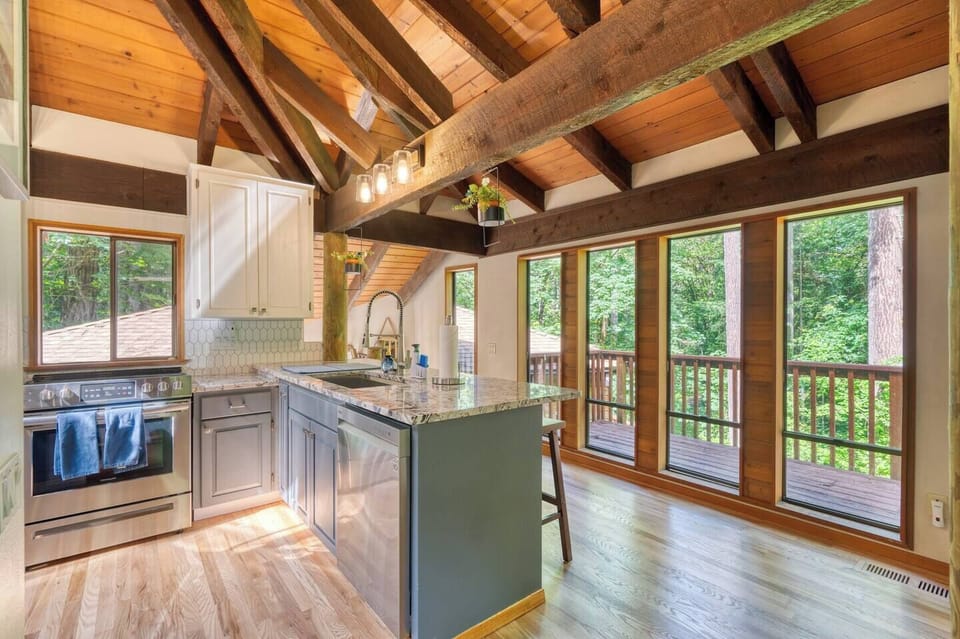 Cook with a view! This kitchen offers more than just modern upgrades, it gives you a front-row seat to the beauty outside, framed by big, bright windows.