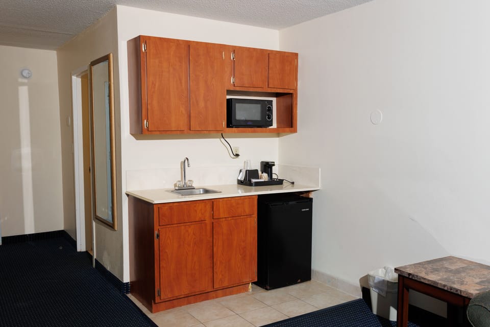 Family Suite with Two Beds with Garden/Pool View | Living area | Flat-screen TV