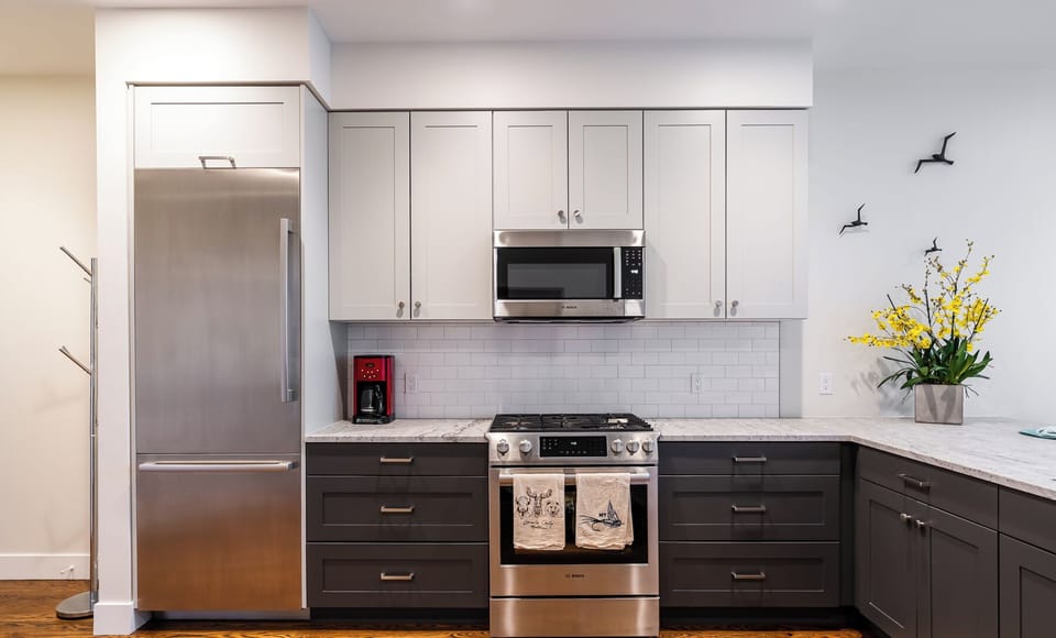 Full kitchen with drip coffee machine.