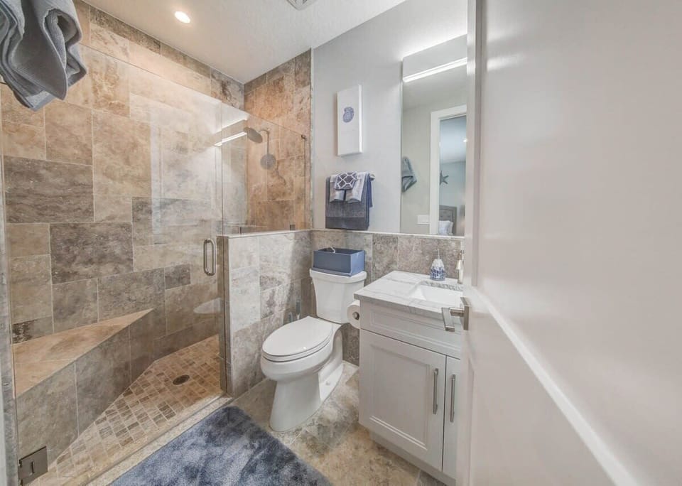 Bathroom #1 • First Floor — Private en-suite for Bedroom #1 featuring a spacious walk-in shower.