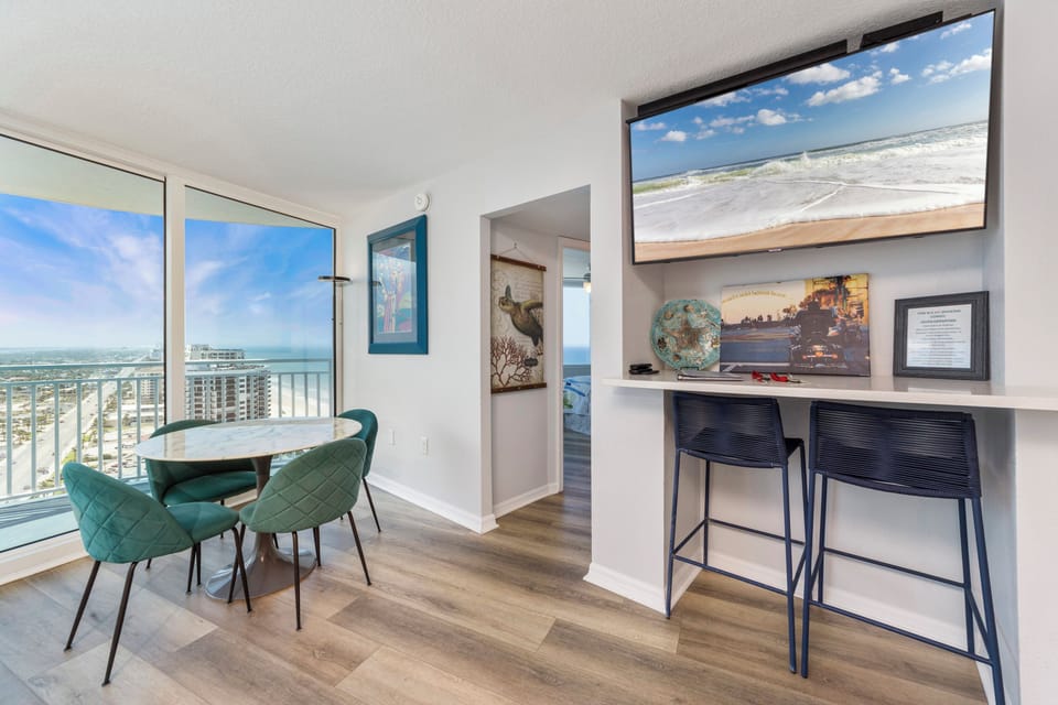 TV area with bar height chairs for extra seating