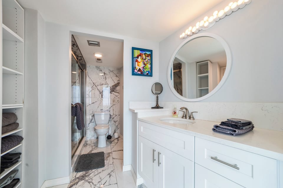 Master bathroom with a built in closet for storage