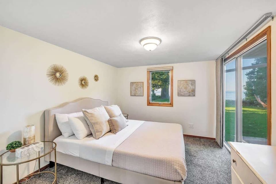 Serene Bedroom Retreat: Wake up to beautiful views and stylish decor in this tranquil getaway!