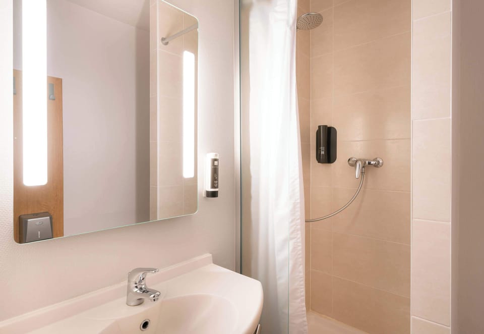 Shower, towels, soap, toilet paper