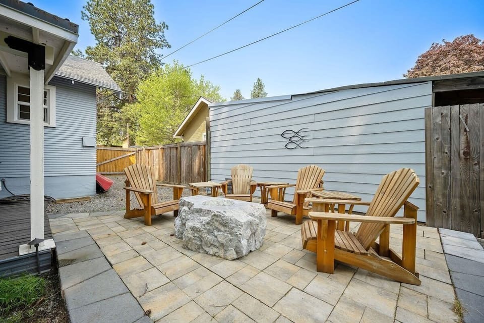 Gather around your private stone-topped patio for evening conversations in comfortable Adirondack chairs under the open sky.