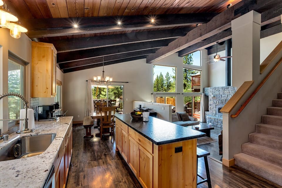 The open-concept kitchen flows seamlessly into the living and dining areas.
