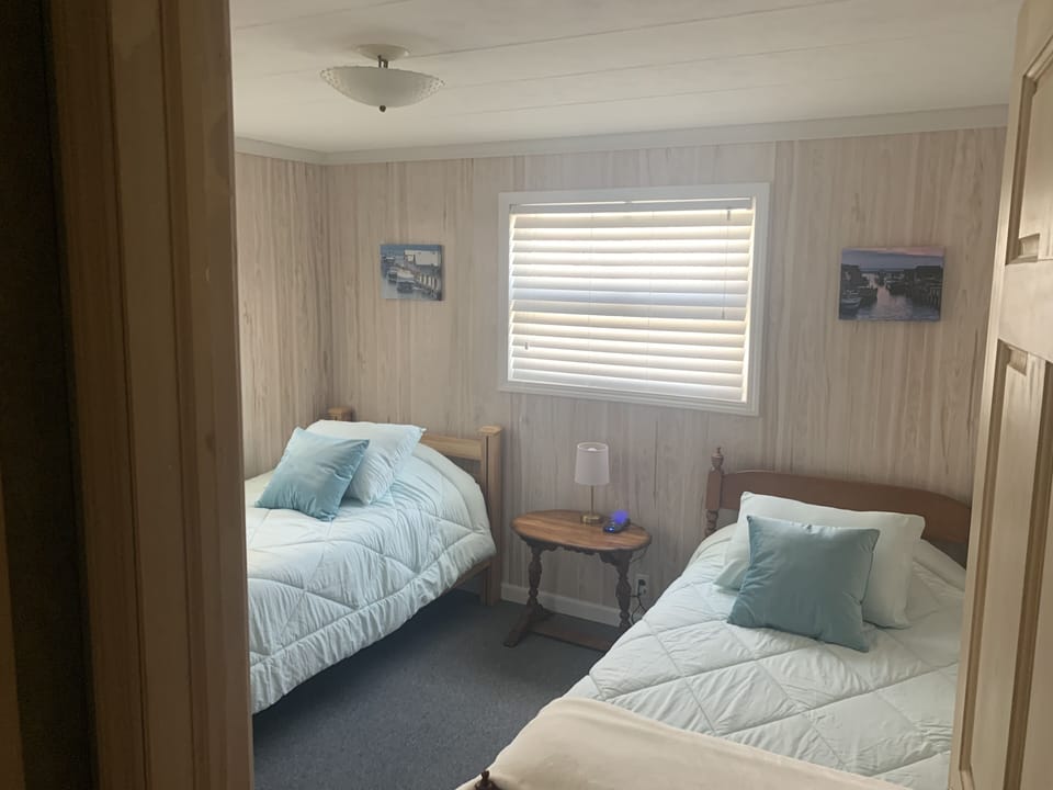 Twin Beds 
- Cordless Phone Charger
- Full Length Mirror
- Closet & Dresser
 